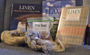 Books, seeds, flax strick, and yarn.